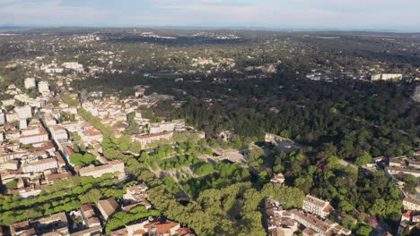 Jardins-de-la-Fontaine-aerial-back-traveling-over-Nîmes-France-sunny-day